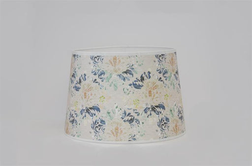 This damask inspired floral print features a variety of colors in elegant unity. Navy or Indigo blue and seafoam green petals pop on the ivory background tones, with subtle hints of lime green, white, and peach. 12" base diameter, this style of Parchment