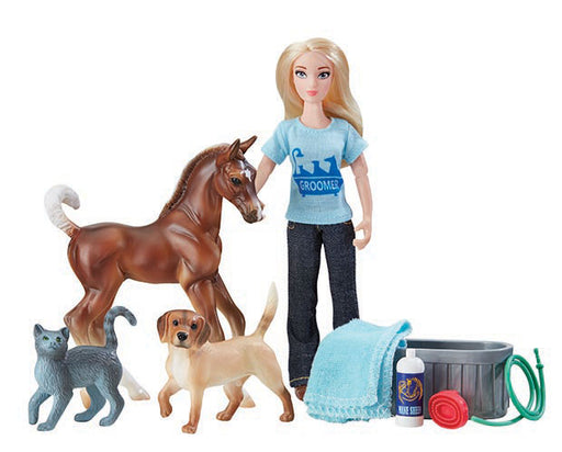This engaging set from Breyer Model Horses includes everything needed to help the groomer get the animals clean and looking great. Includes: 6" articulated doll, pony, cat, dog, water trough, towel, shampoo bottle, and curry comb. Classics Size Models.