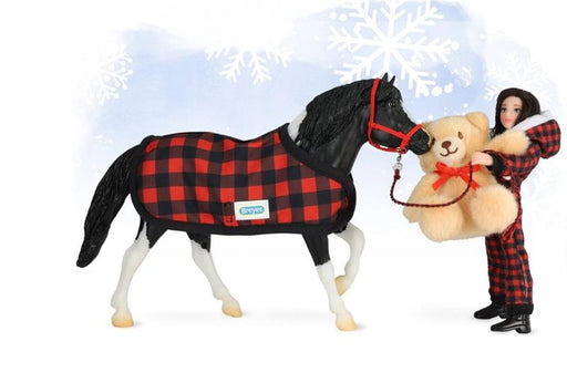 Christy approaches the stall of the tobiano pinto pony with her teddy bear. Cinders, always curious and up for a bit of mischief, gives the bear an affectionate poke with his muzzle - a new friend!